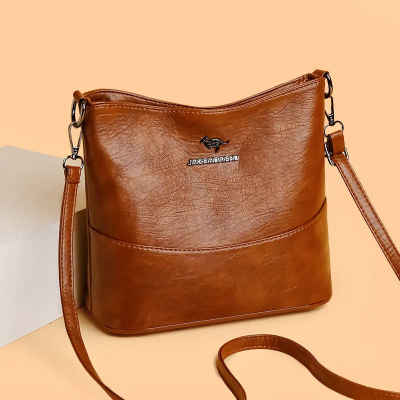 Women's bucket-shaped leather shoulder bag in minimalist style with large capacity
