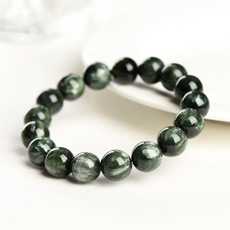 Green Dragon Crystal bracelet with 8-9mm round beads showing Ruyi design detail and geometric shape
