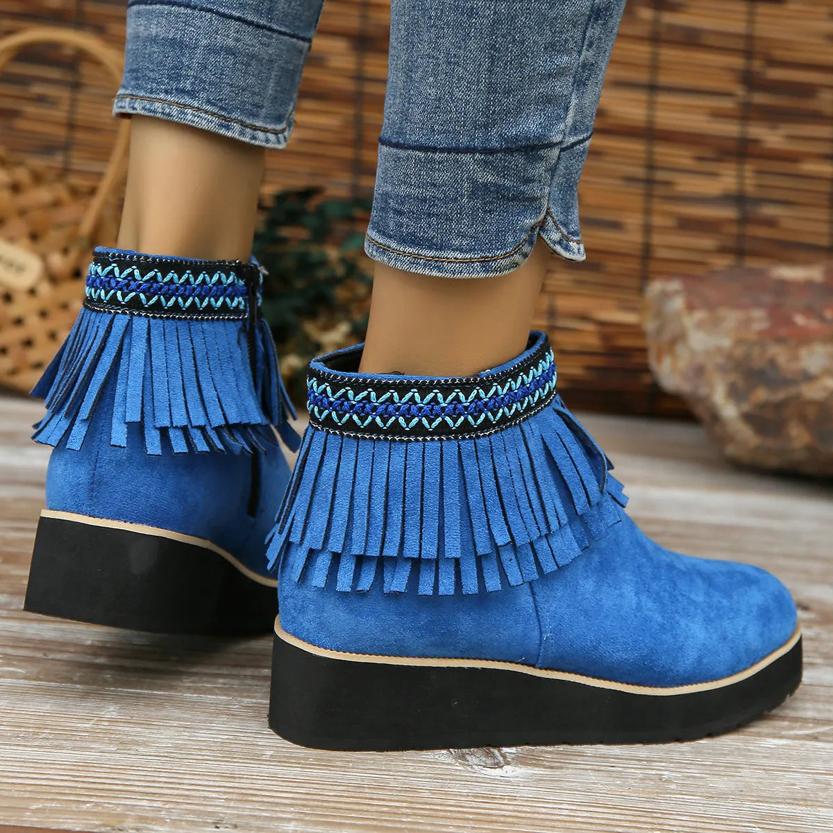 Women's suede wedge bootie in dark brown with side zipper and tassel detail on a 4cm rubber sole