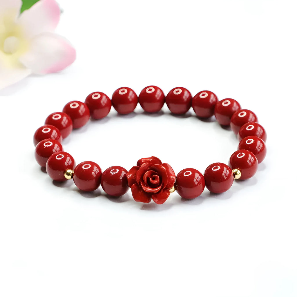 Purple gold sandstone cinnabar bracelet with 8mm rose-carved beads on wrist