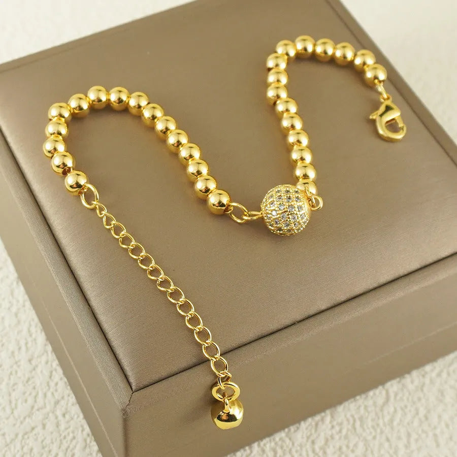 Women's copper bracelet with heart shape and round zircon stones in Arabic design style