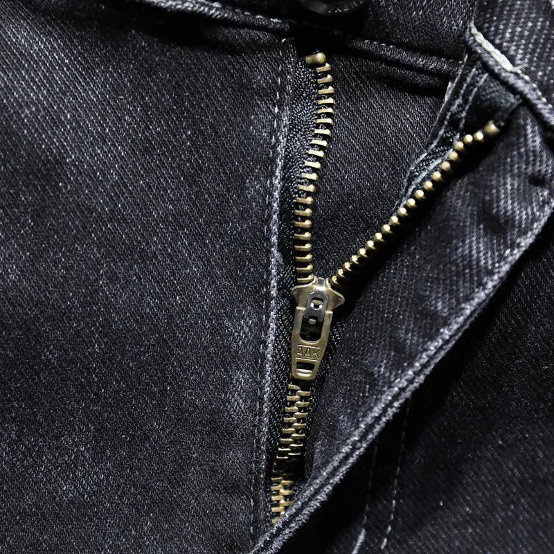 Men's dark grey loose straight-leg cotton denim jeans with mid waist, zip fly and cat whisker finish