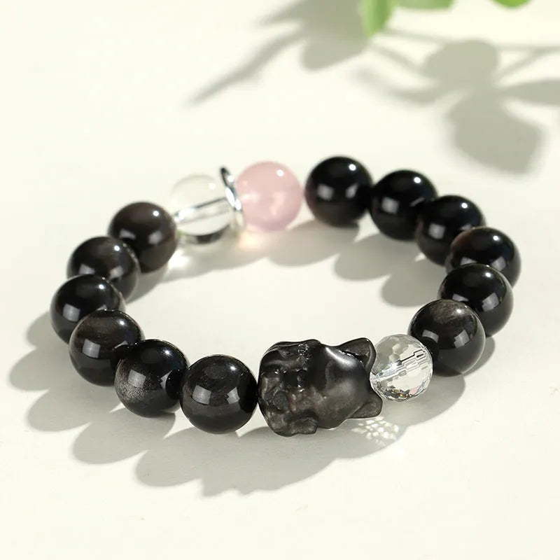 Silver stone bracelet with fox charm and pink, navy blue, black, snowflake ghost crystals.