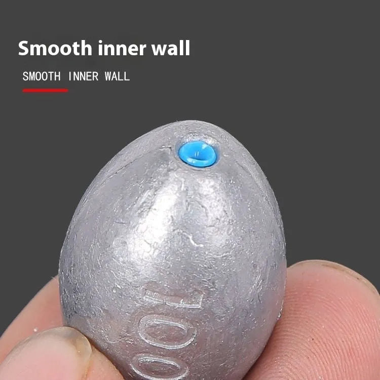 Scale Tongxin rugby-shaped olive lead sinker with plastic core channel and scale texture pattern for sea fishing