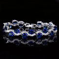 Copper-plated gold bracelet with geometric design and AAA+ zircon stones in five colour options on 18.4cm adjustable band