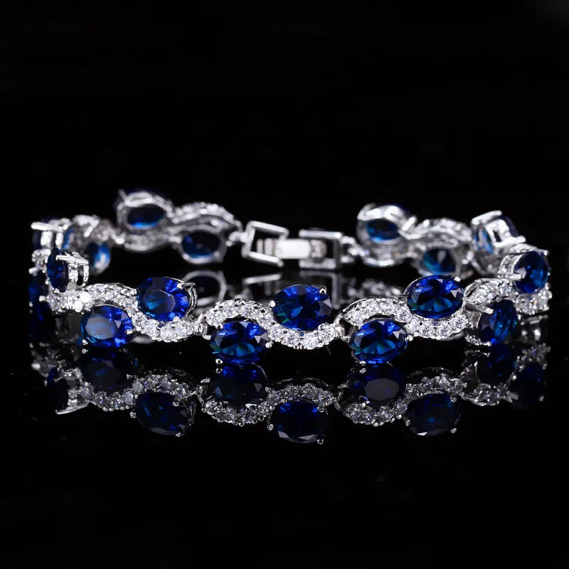 Copper-plated gold bracelet with geometric design and AAA+ zircon stones in five colour options on 18.4cm adjustable band