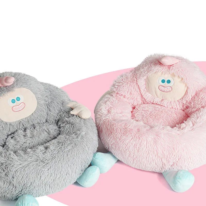 Grey plush circular pet nest bed with high sides for a cat or dog to sleep in.