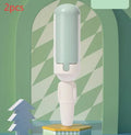 White green coloured pet hair remover roller with a non-slip handle on a fabric sofa.