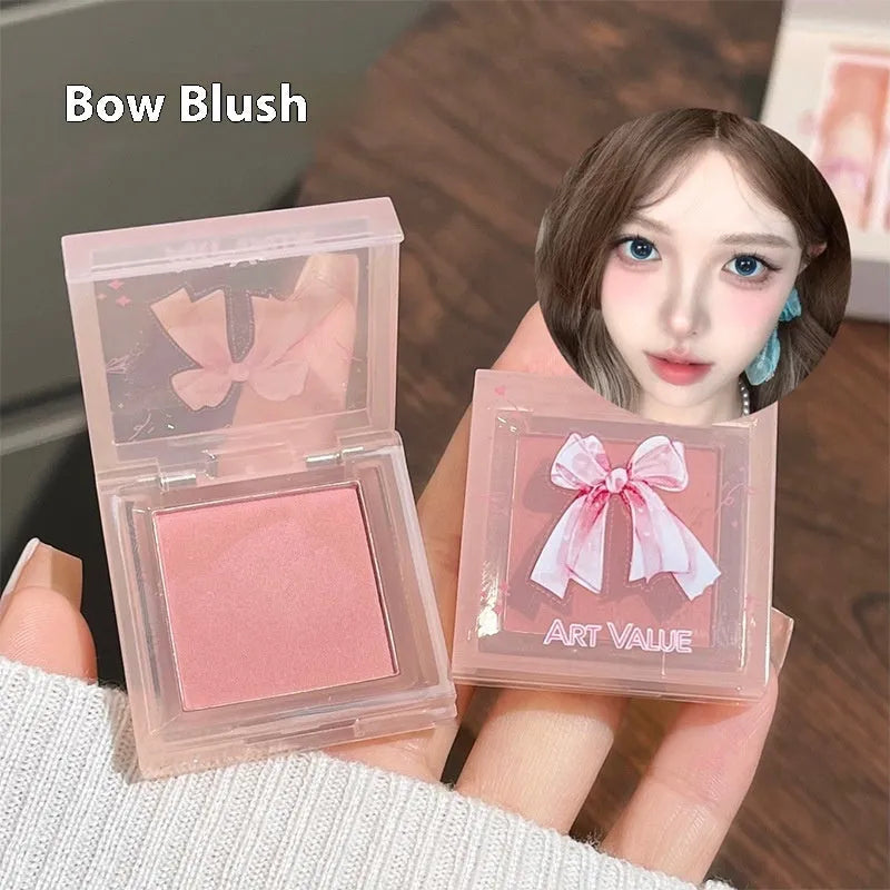 Butterfly Box make-up set with pink matte lip mud, blusher, and necklace.