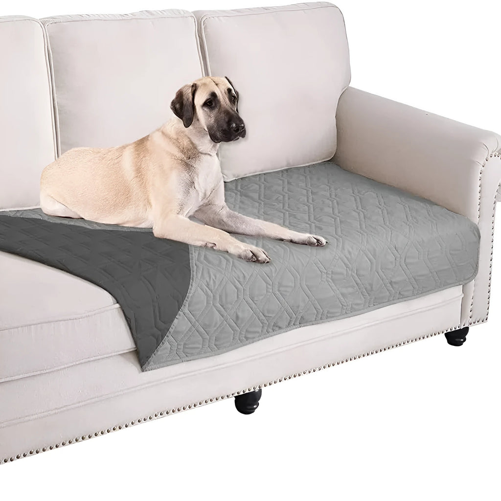 Reversible waterproof dog blanket sofa cover in grey, laid flat on a sofa