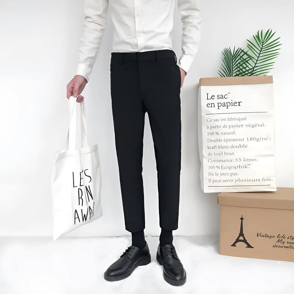 Men's straight-leg cotton trousers with drawstring waist in black, grey or khaki colours.