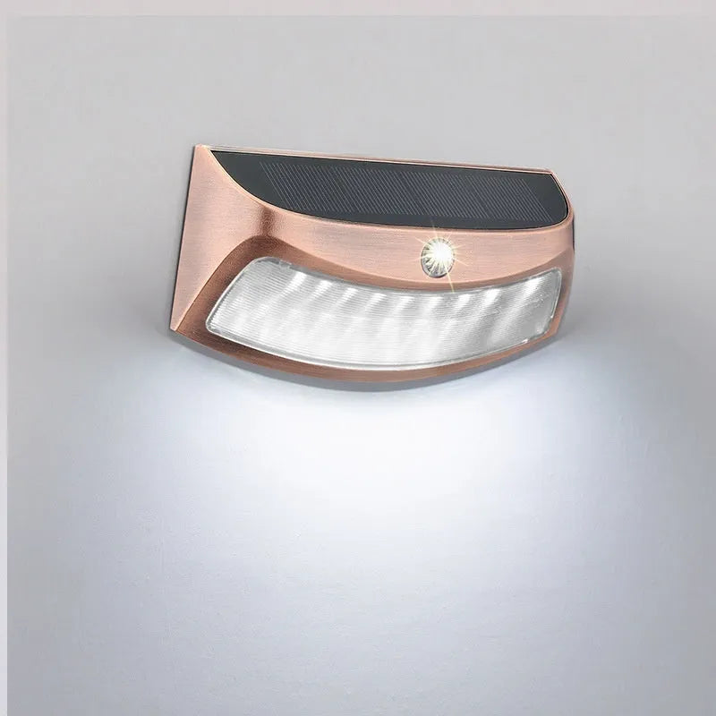 Solar outdoor wall lamp with smiling face design measuring 153x76x38mm for garden lighting