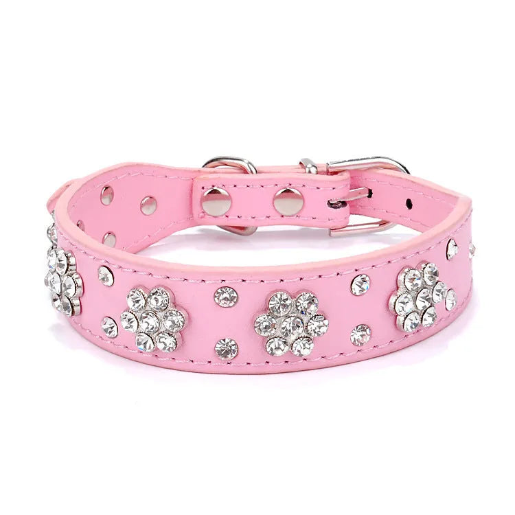 Black PU leather dog collar with rhinestone flower pattern and studded design, adjustable with metal eyelets