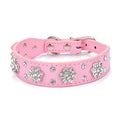 Black PU leather dog collar with rhinestone flower pattern and studded design, adjustable with metal eyelets