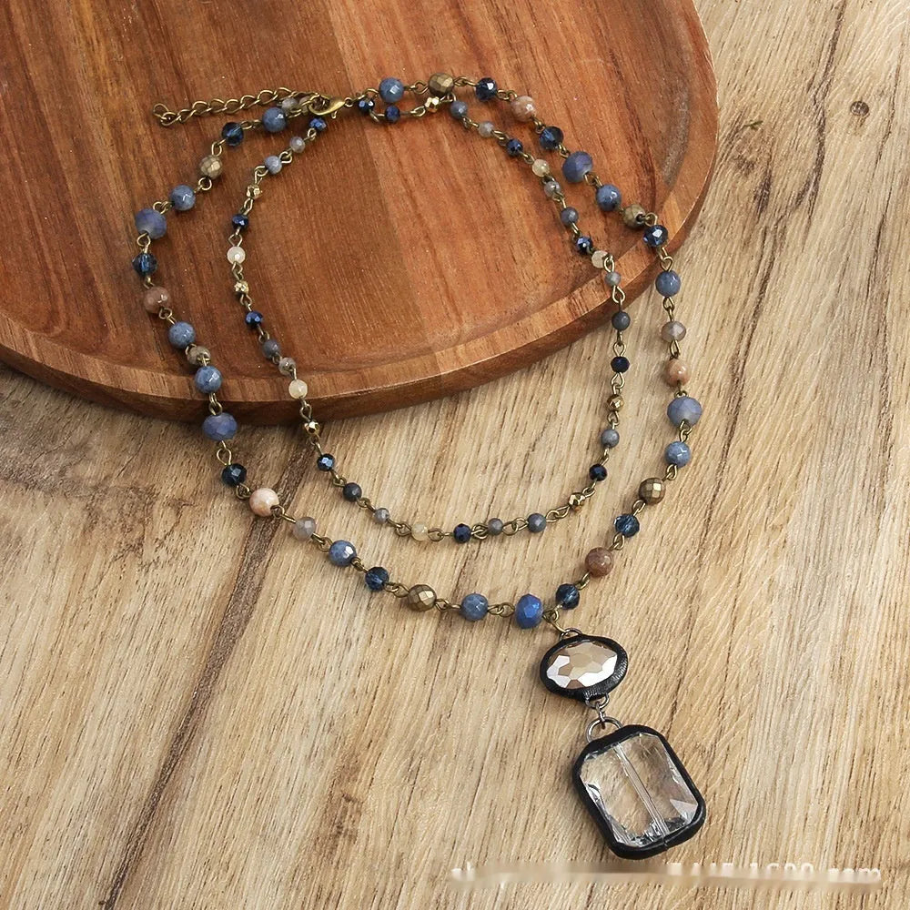 Two-layer tribal necklace with a stone and glass pendant on an alloy chain.