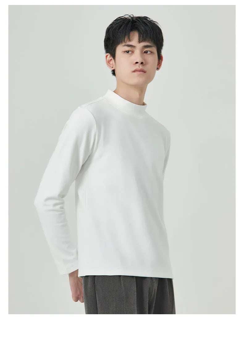 Man's brown long sleeve Dralon T-shirt with a half-high collar, laid flat.