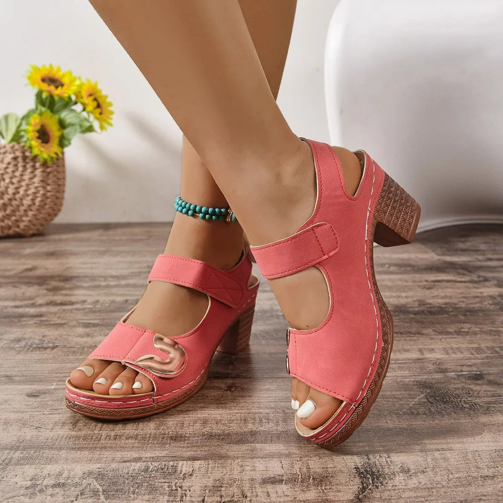Light brown Roman sandals with Velcro strap and round toe on a rubber sole