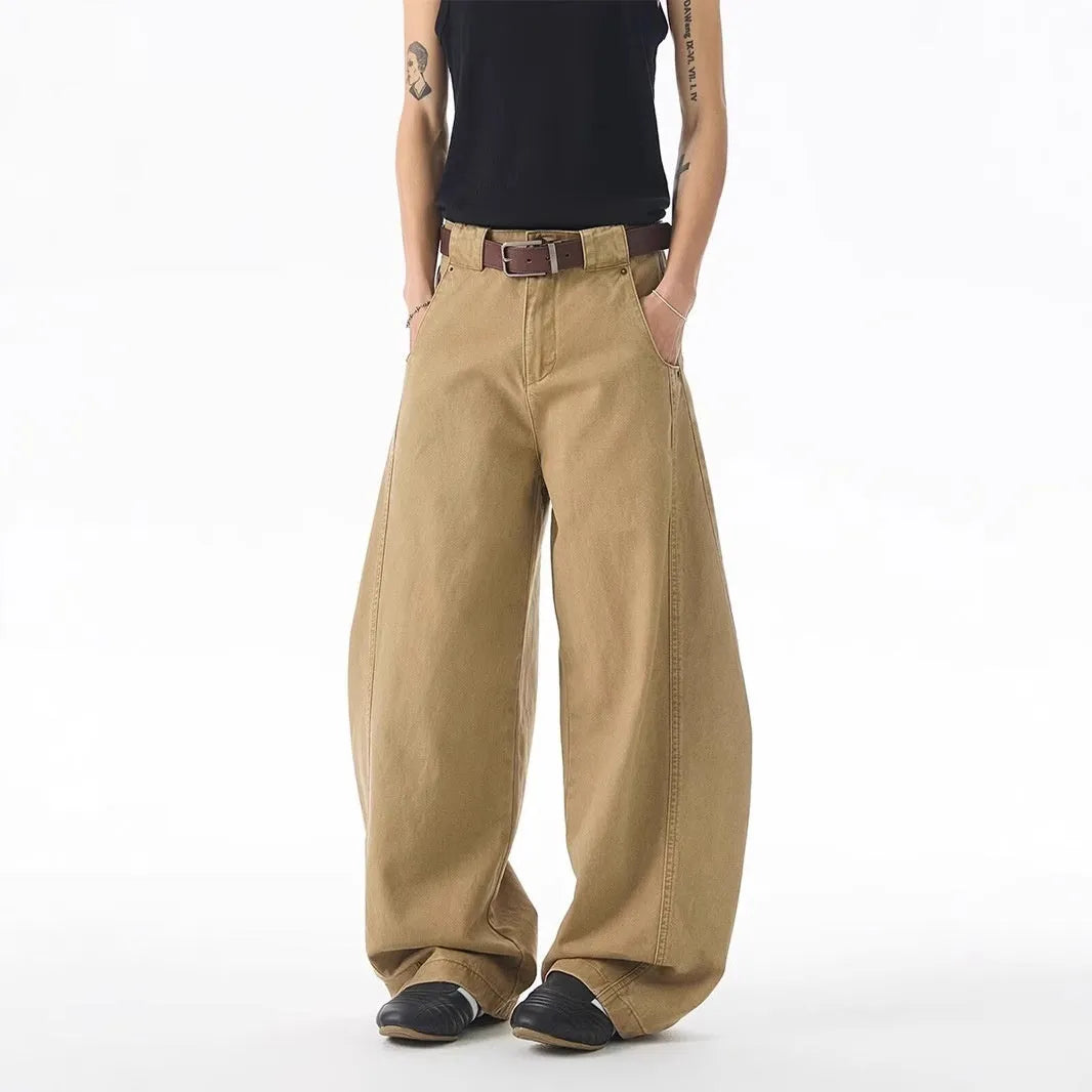 Men's brown straight-leg jeans with micro-elasticity, button-fly opening, and mid-waist design