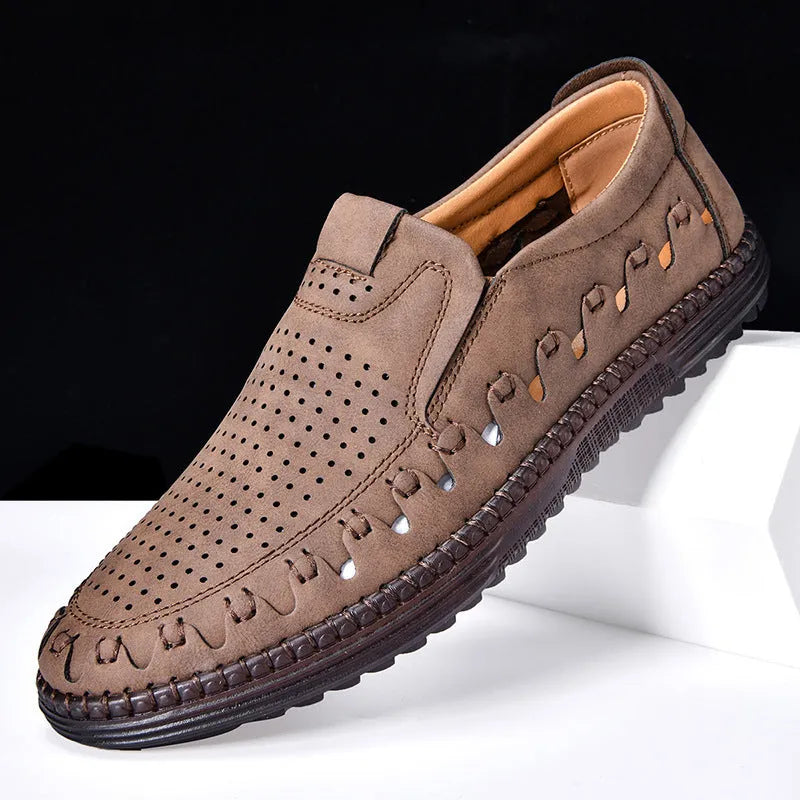 Men's brown slip-on leather shoes with round toe, low-top design, and hollowed-out details on artificial PU upper