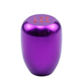 Polished aluminum gear shift knob with three rubber adapter sleeves for manual transmission vehicles