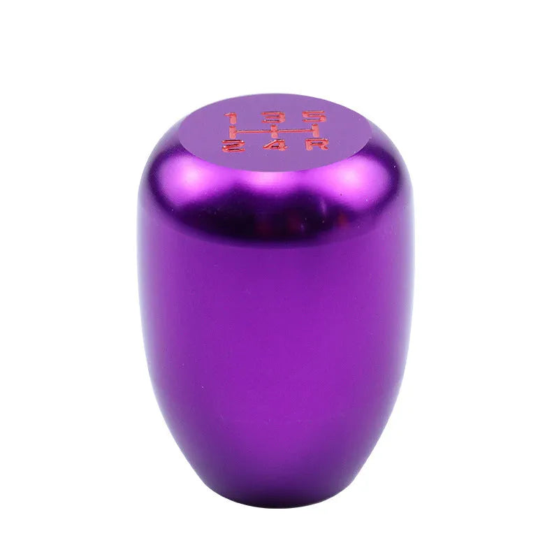 Polished aluminum gear shift knob with three rubber adapter sleeves for manual transmission vehicles