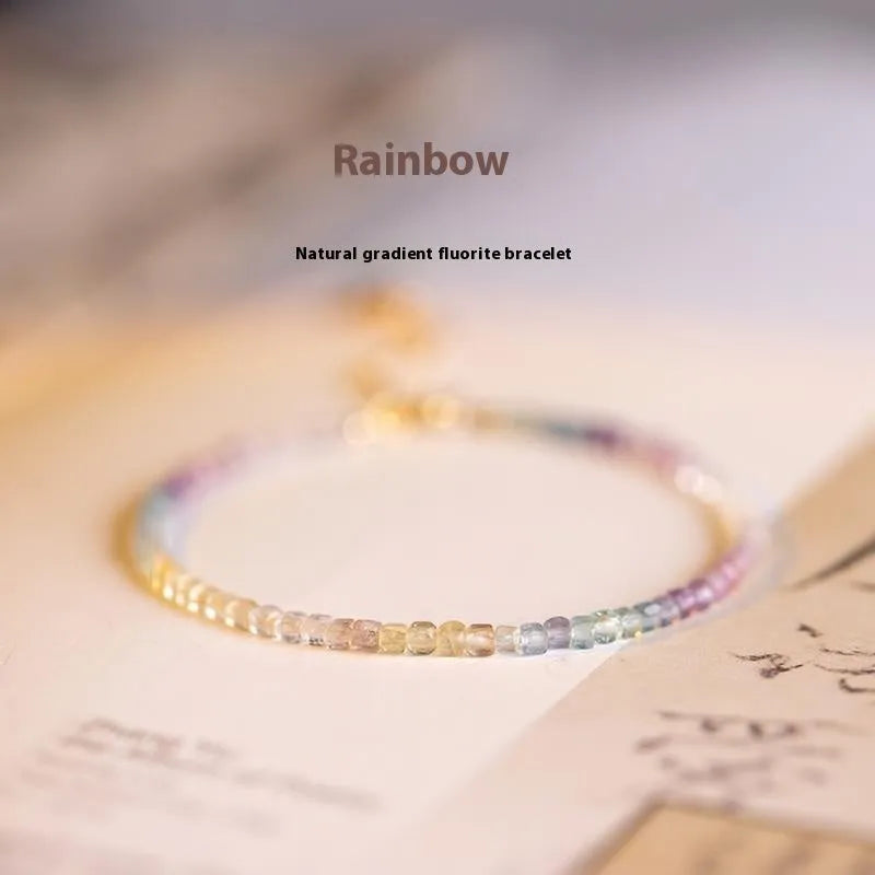 Handmade women's rainbow fluorite bracelet with copper geometric settings