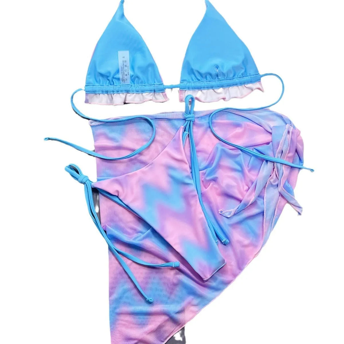 Women's tie-dye patterned bikini swimsuit with a removable skirt, showing bra top and briefs.