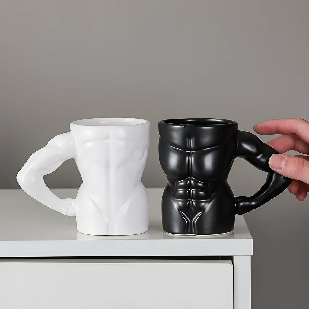 Matte black ceramic mug with muscle man design and 300ml capacity.