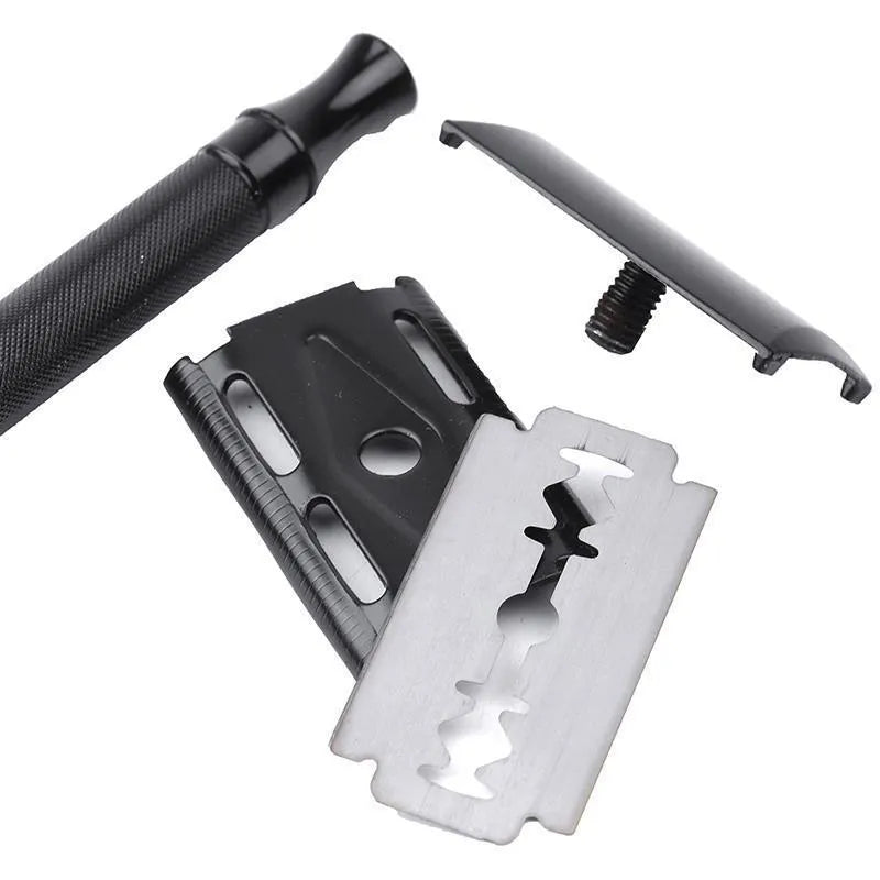 Old-fashioned manual pogonotomy metal scraper with brush set in black or silver colour