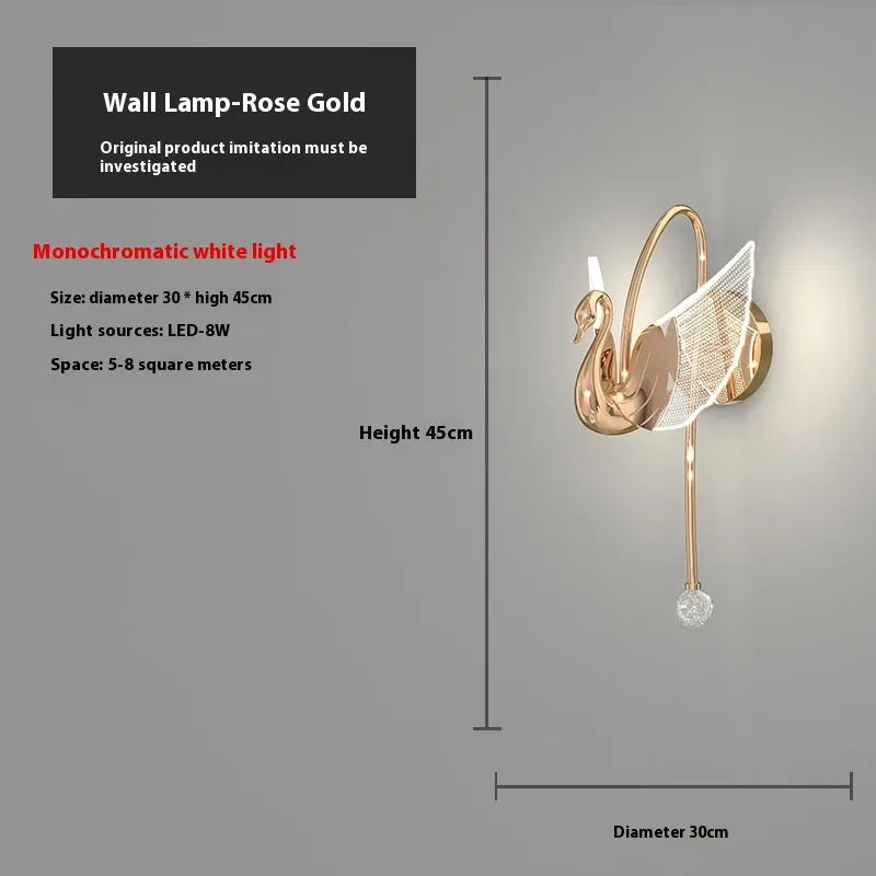 Gold swan-shaped wall lamp with acrylic shade and iron body, mounted beside bed with adjustable LED lighting