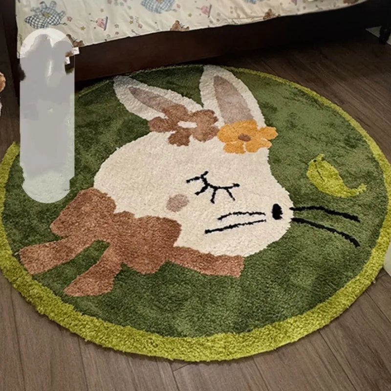 Round light pink polyester floor mat with a cute white rabbit illustration on a wooden floor.