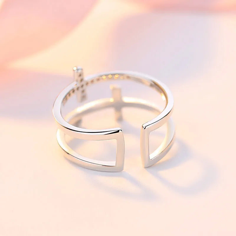Women's adjustable copper ring with zircon gems in geometry design, showing open and closed positions