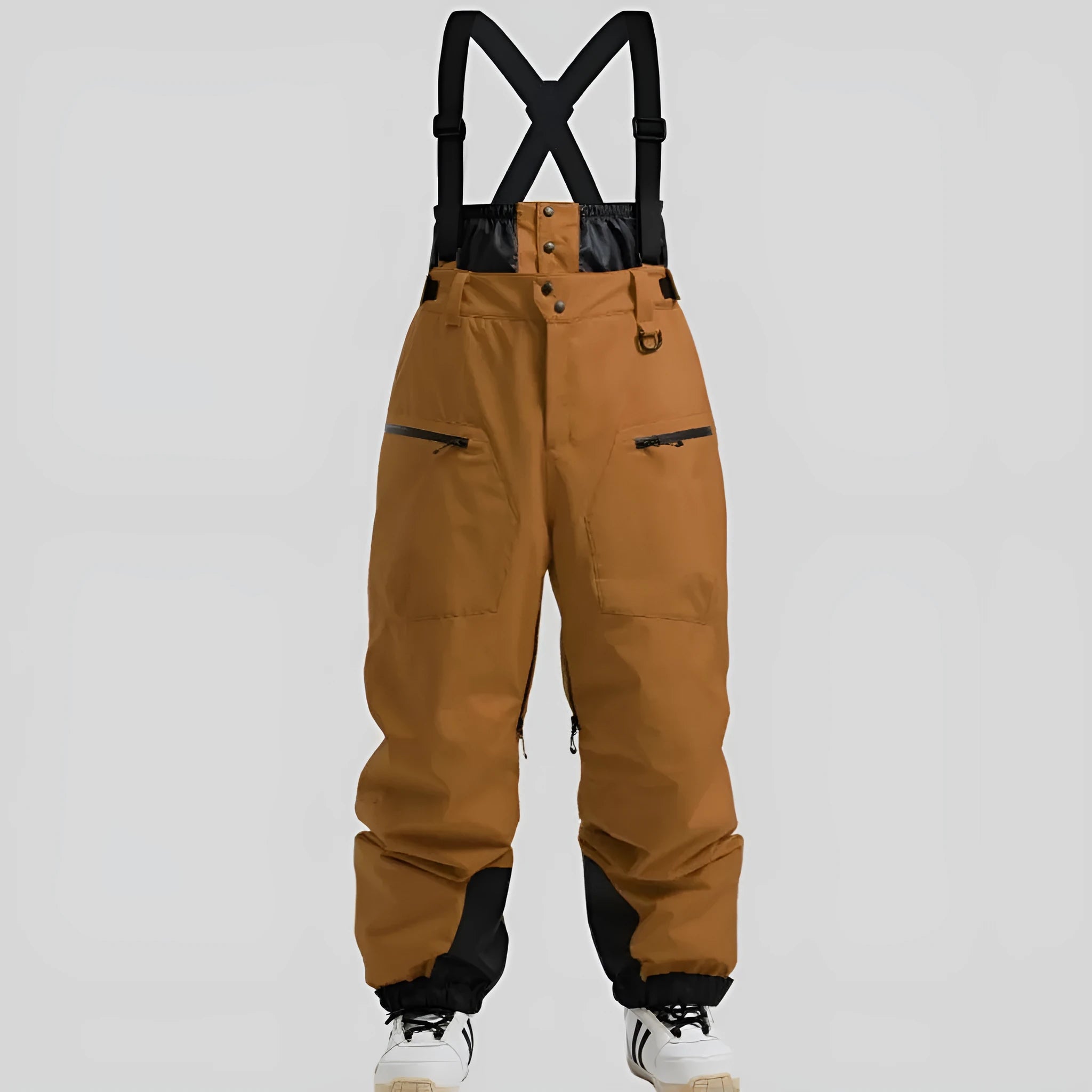 Man modelling black waterproof ski trousers with an adjustable calf strap.