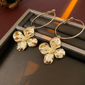 Silver needle metal flower earrings with electroplated gold or silver finish and vintage design