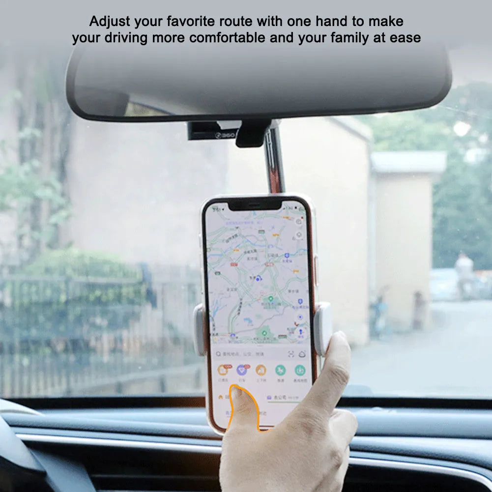 Black car phone holder mounted on rearview mirror with mobile phone secured in adjustable bracket