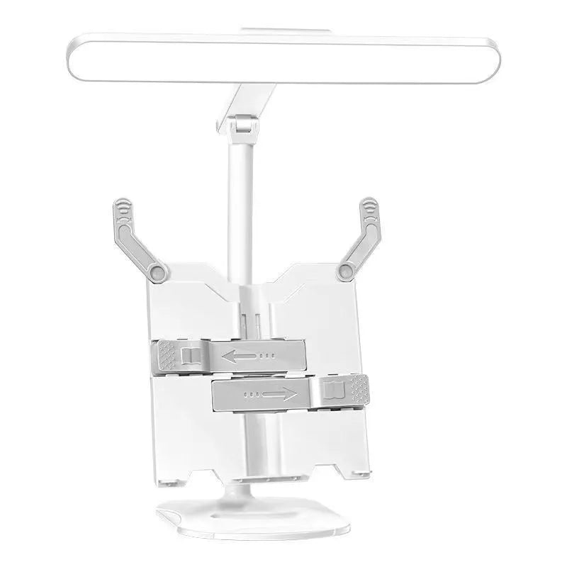 Multifunctional table lamp with adjustable colour temperature and integrated bookshelf on a desk.