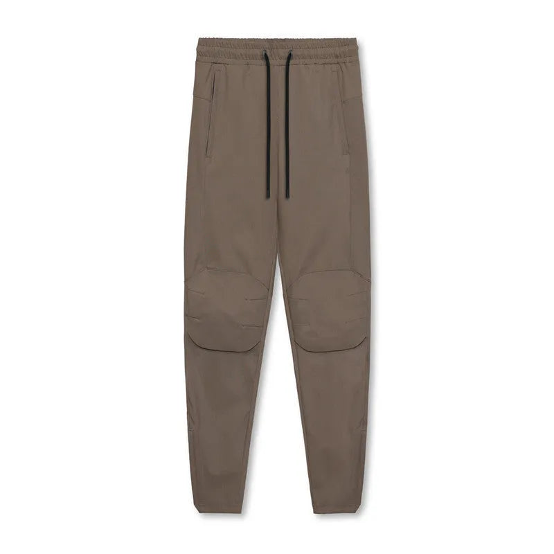 Men's grey fitness trousers with ankle-tied design, quick-drying polyester fabric for exercise