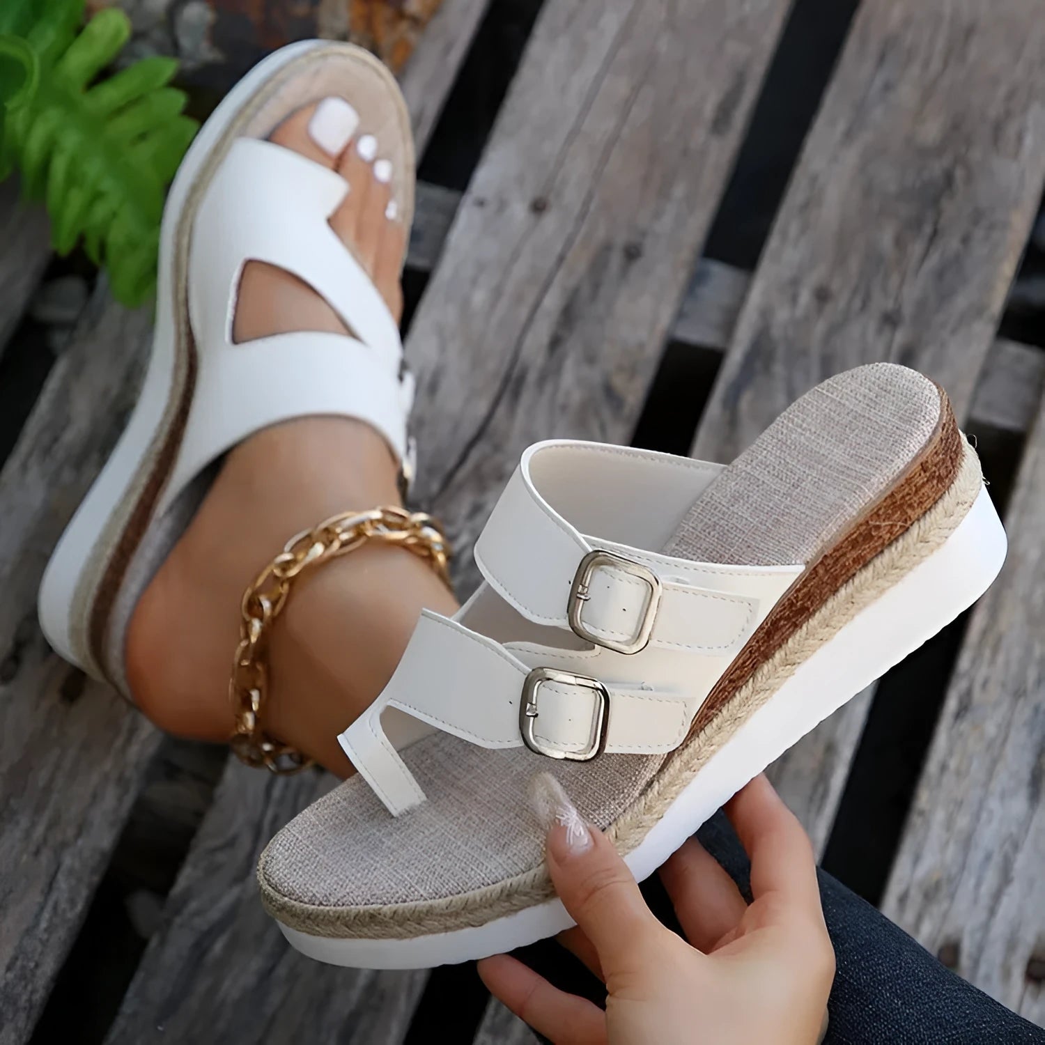 White patent leather women's wedge sandals with finger-fit woven design and peep toe.