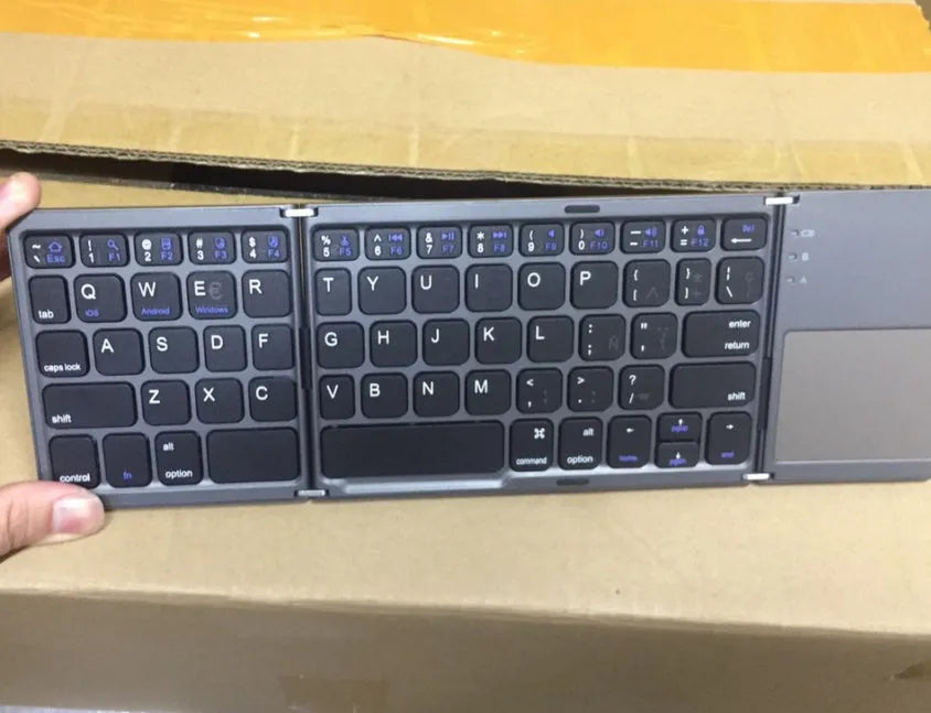 Ultra-thin tri-fold folding touch keyboard in black or silvery white, showing folded and unfolded sizes with touchpad