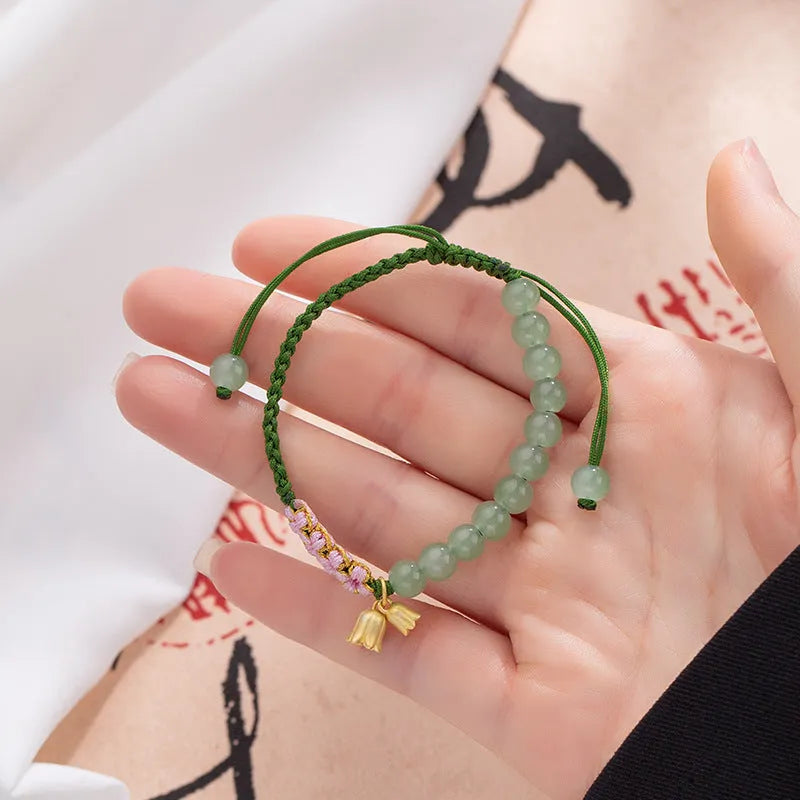 Red rope hand woven bracelet with lily flower design for women in national style