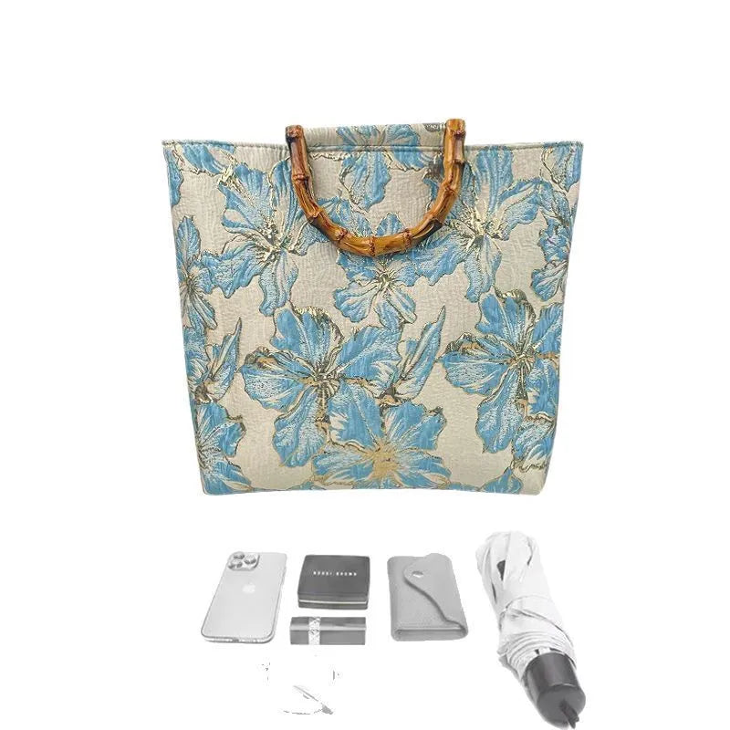 Light blue canvas shoulder bag with bronzing flower pattern and double adjustable straps