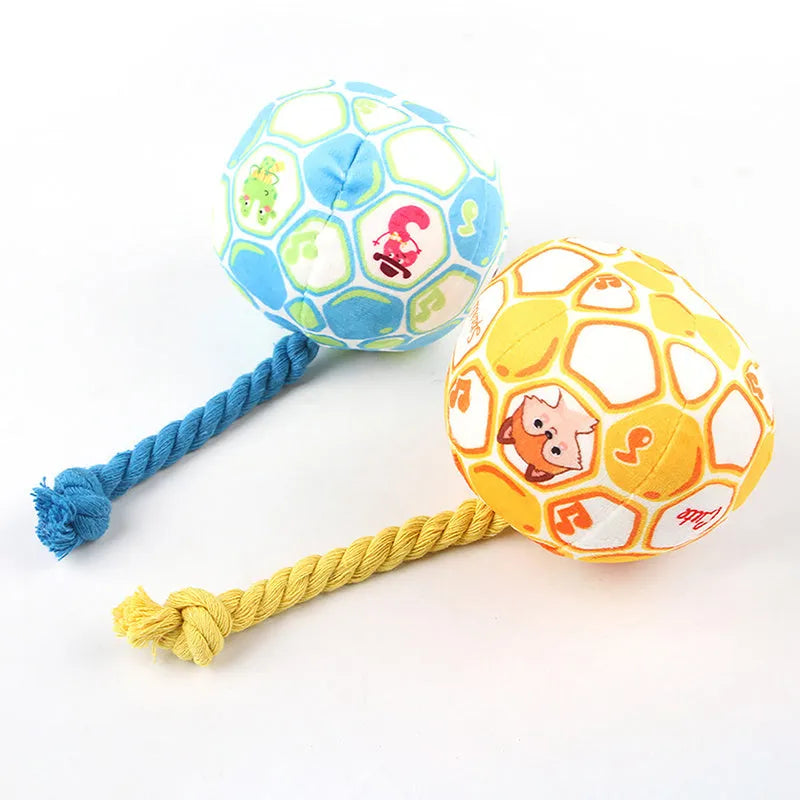 Blue and yellow elastic football dog toy made from cotton rope for tug of war and teeth grinding.