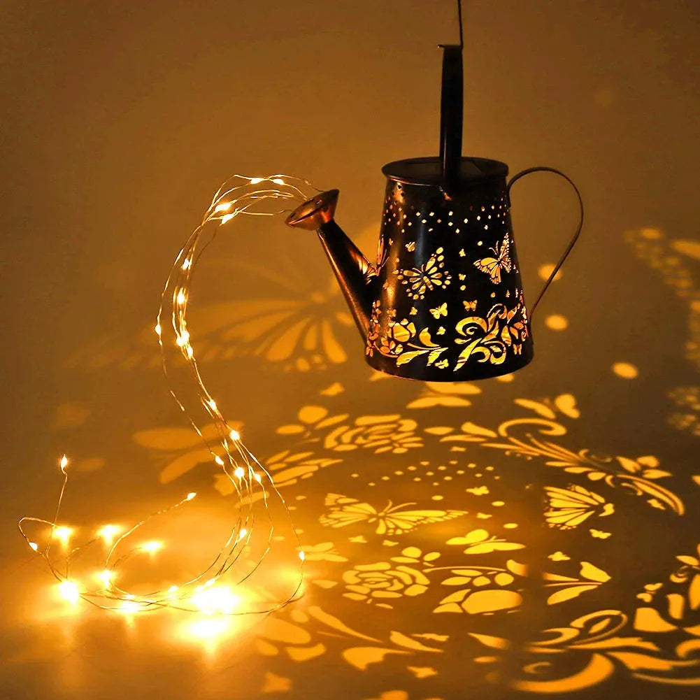 Solar-powered iron garden lamp with tapered butterfly design and warm white LED illumination