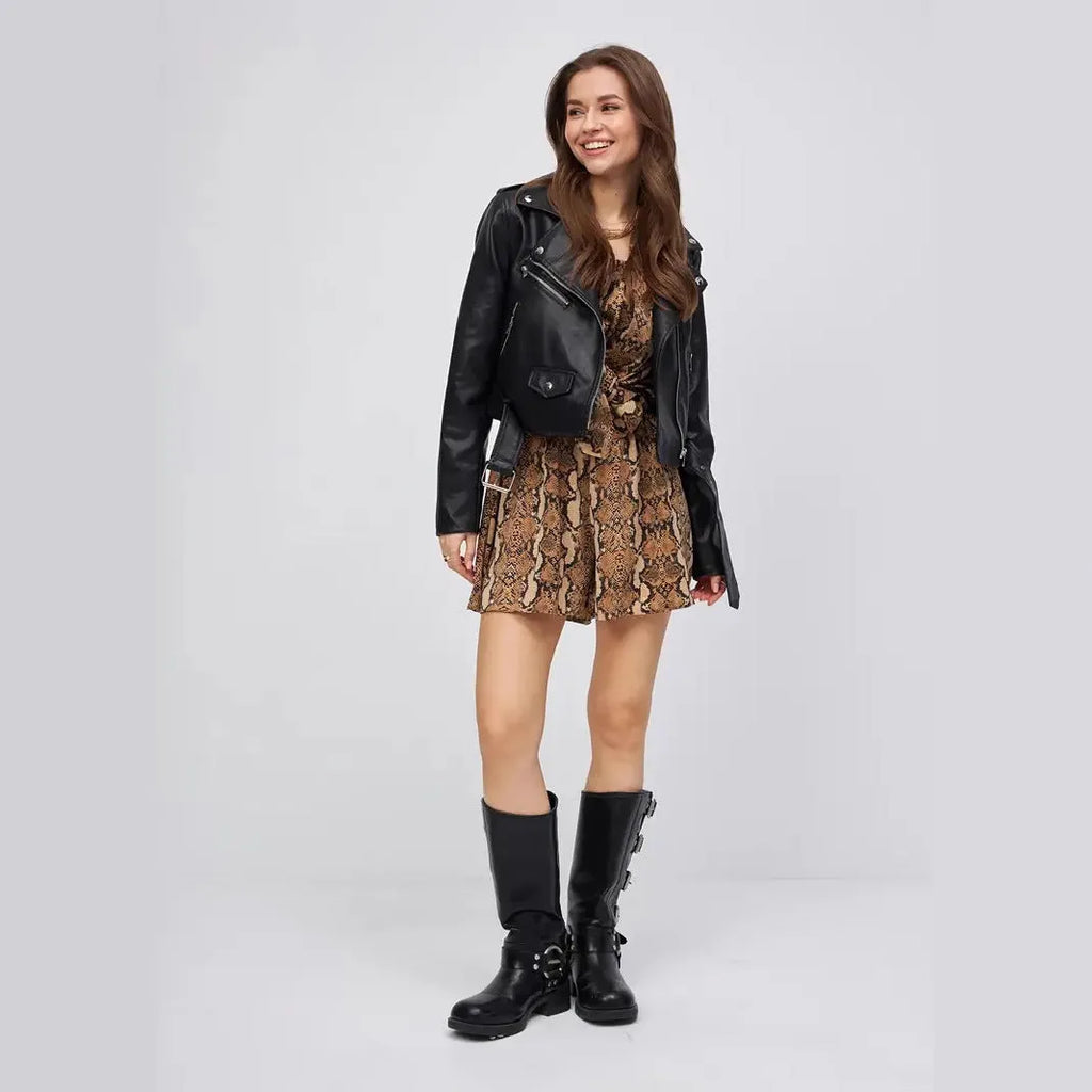 Black women's imitation leather locomotive jacket with regular sleeves on size chart background