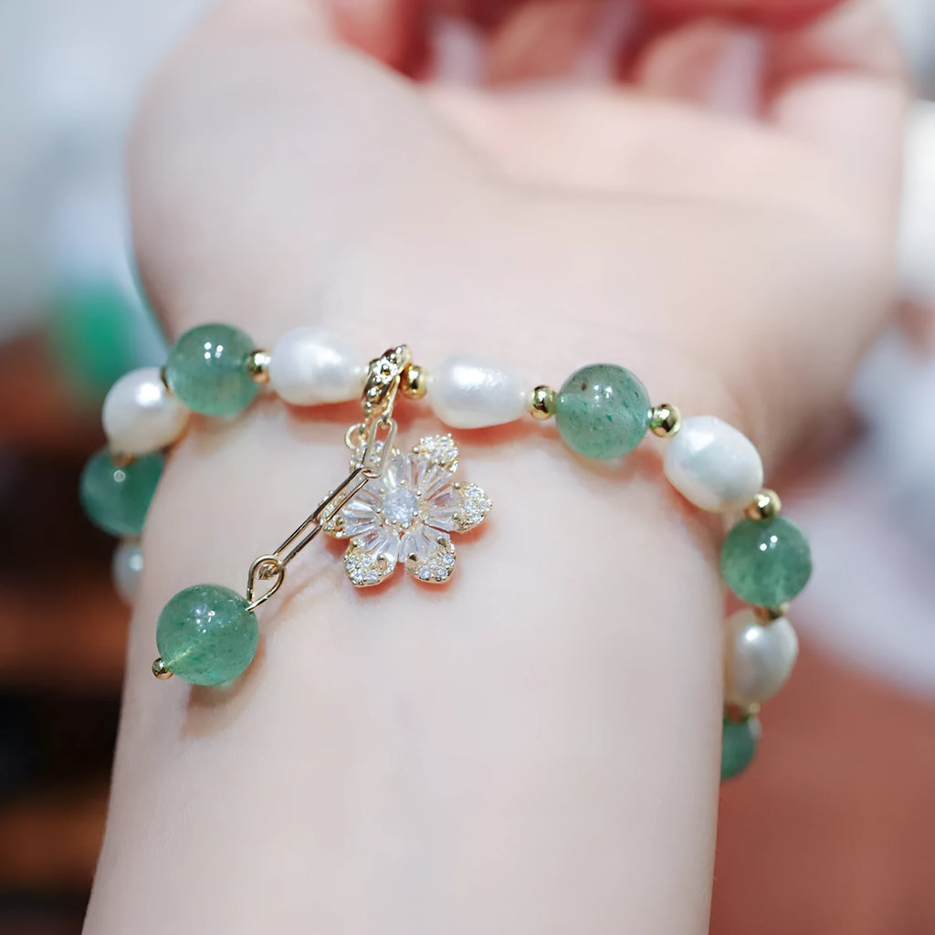 Green strawberry-shaped freshwater pearl bracelet with Chinese knot closure and small flower pendant