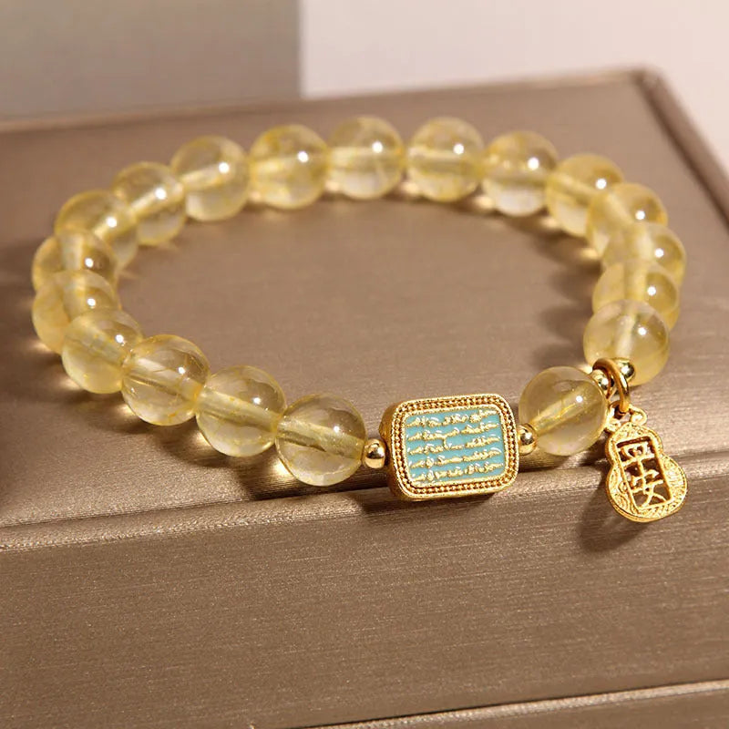 Yellow citrine crystal women's bracelet with rhinestone detailing on wrist