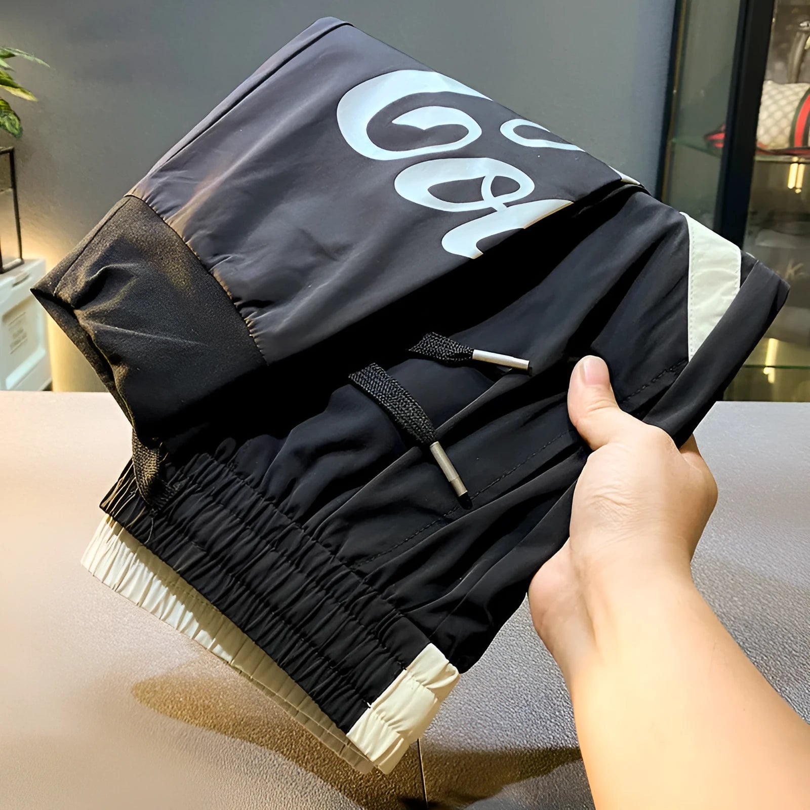 Black men's casual cropped trousers with elasticated ankle bands made from ultra-thin ice silk cotton.