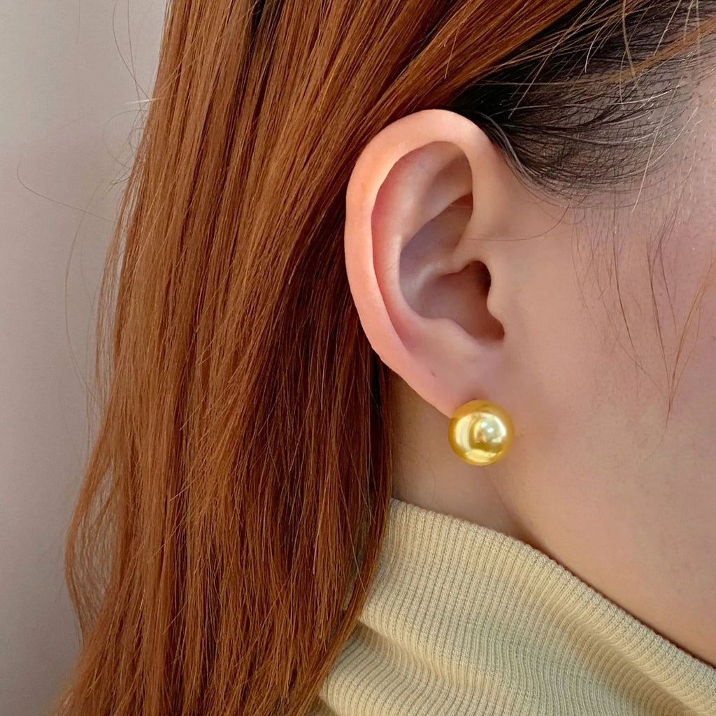 Large pearl stud earrings with geometric eight-point star setting in silver, showing four size options from 8mm to 14mm