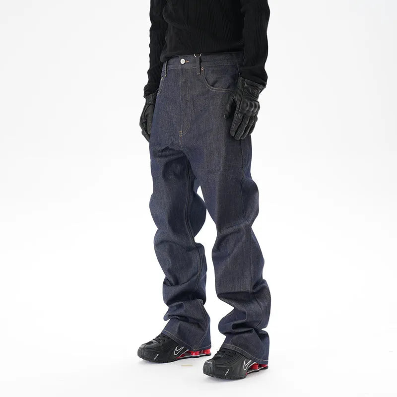 A pair of dark blue loose straight-leg men's jeans on a plain background.
