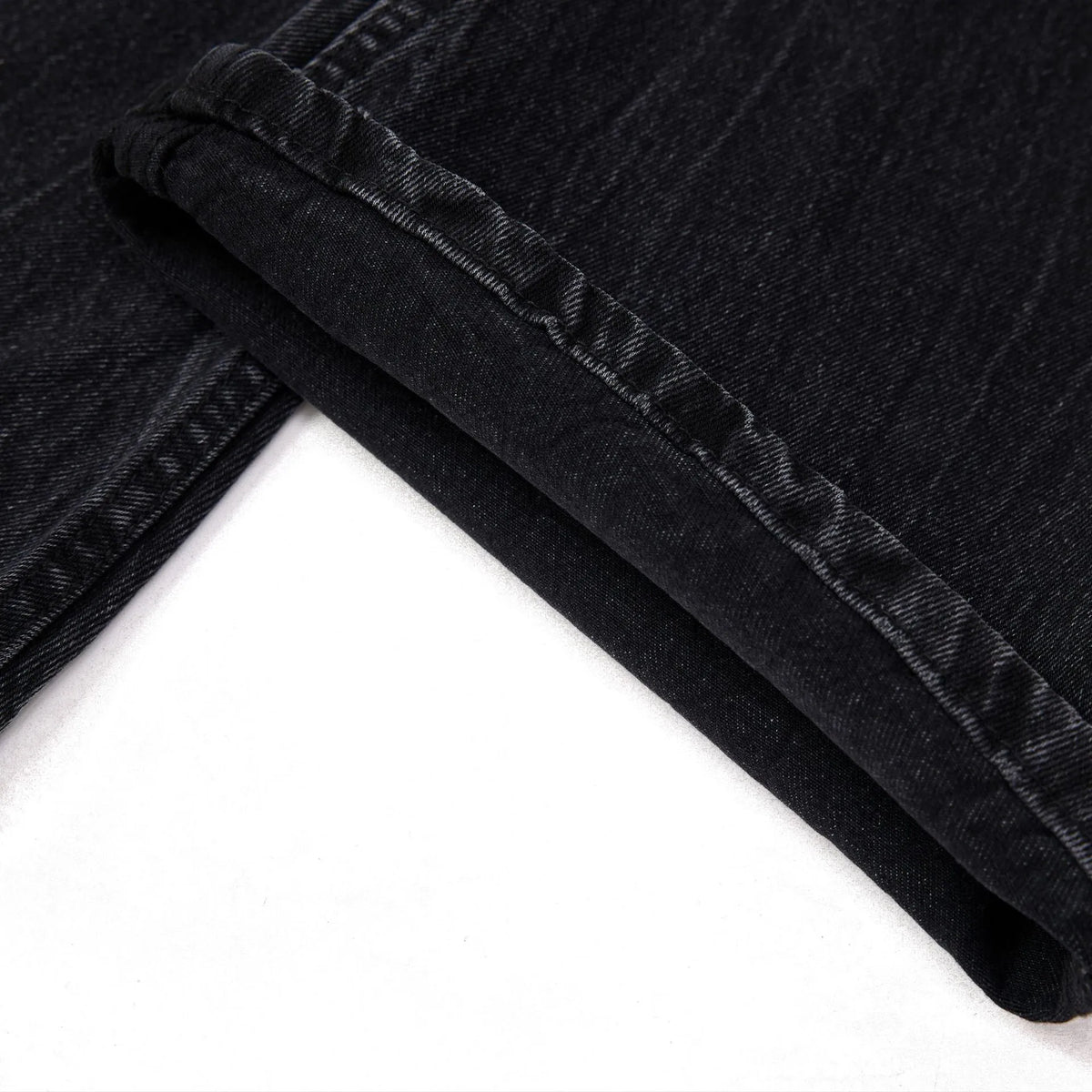 Men's black straight-leg jeans with faded lightning crack pattern on cotton denim